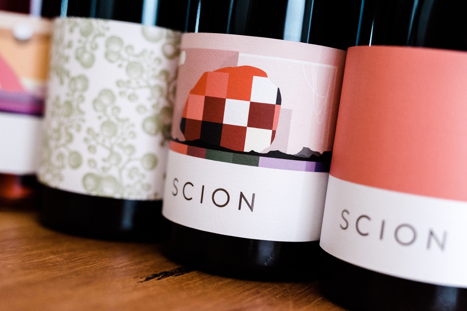 Close-up of colourful labels on wine bottles